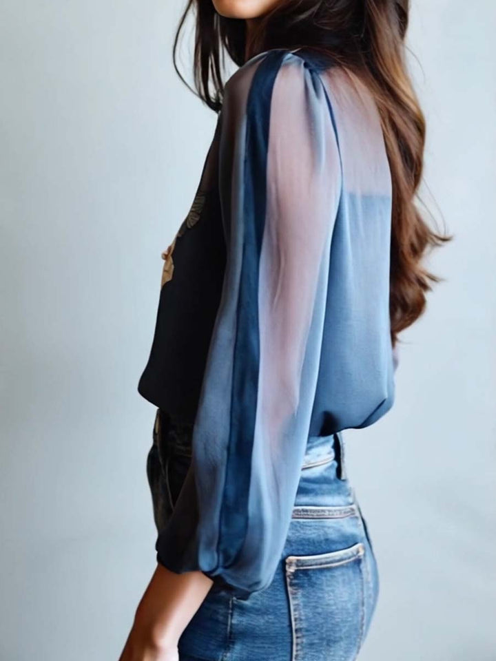 Fashionable women's blouse with an all-over floral boho pattern, suitable for casual outings.