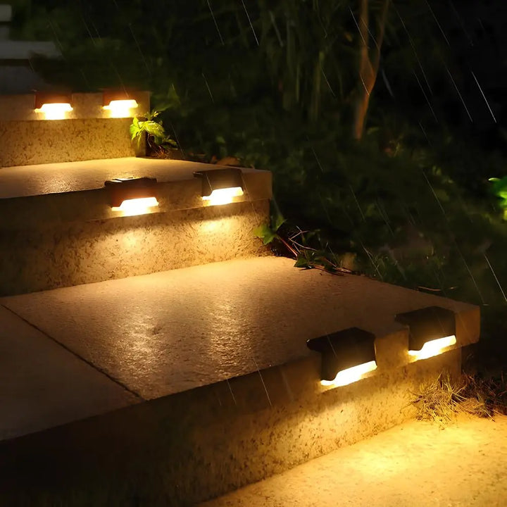 Nvroome solar step lights installed on multiple steps, creating a continuous warm light pathway.