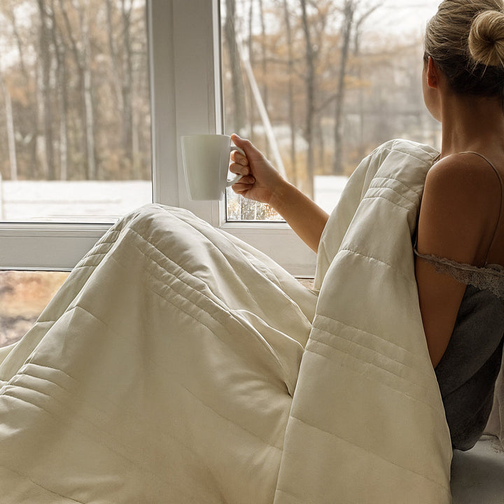 Cooling comfort blanket, promoting calm sleep with its temperature regulating design.