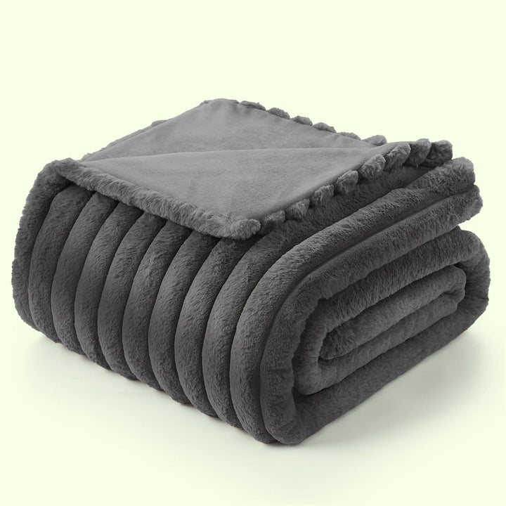 Plush cozy comfort fleece blanket, a fluffy throw for your living room or bedroom decor and warmth.
