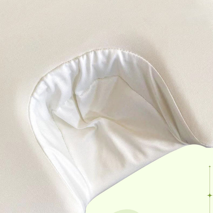 Relaxation pillow designed for ultimate sleep comfort; features ergonomic neck support & soft satin.