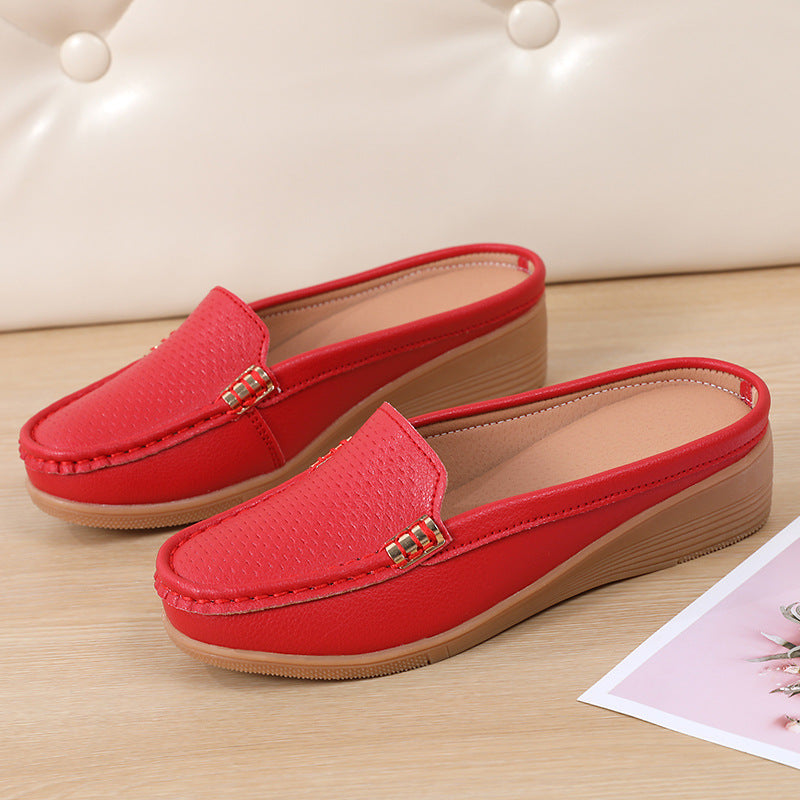 Stylish women's flat mules with a comfy wedge, slip-on design for effortless style.