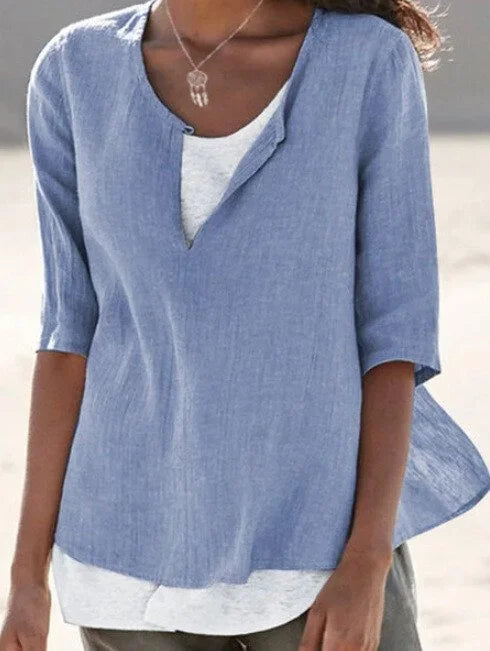 Women's knit V-neck tunic blouse, loose fit, 3/4 sleeve, comfortable and versatile for everyday style.