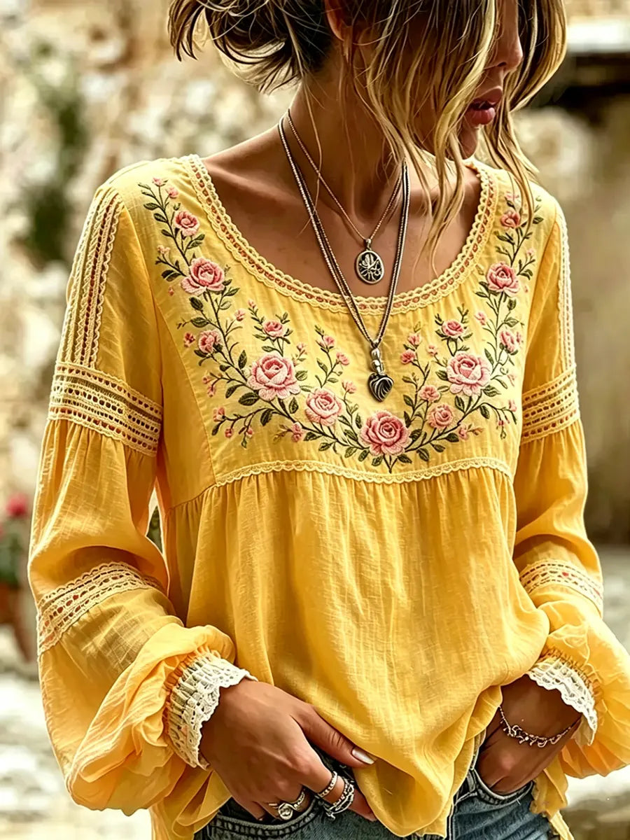 Full view of a women's relaxed fit long sleeve embroidered blouse, designed for comfort and style.