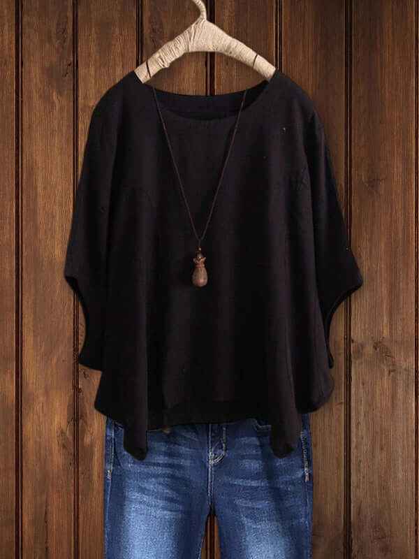Stylish women's relaxed fit crew-neck dolman tunic top, a versatile blouse for easy, everyday fashion.
