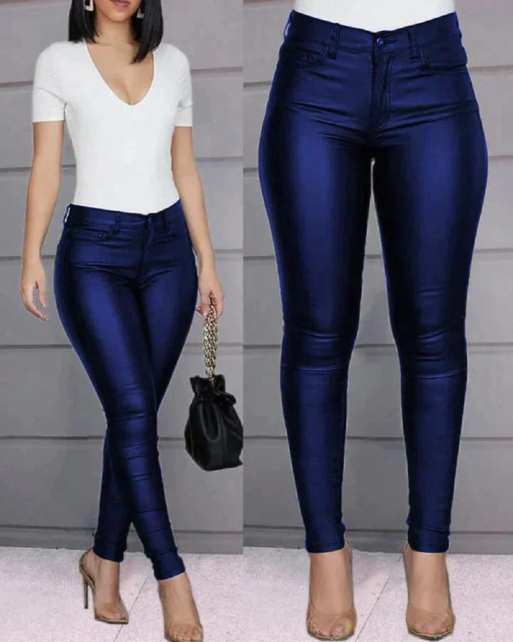 Trendy women's faux leather pants in a chic red, perfect for a stylish and modern attire.