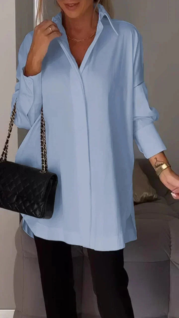 Flowy women's elegant oversize blouse. Chic loose fit for comfortable, stylish everyday wear.