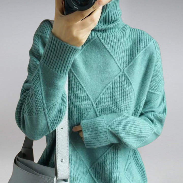 Full view of a women's cozy turtleneck sweater. Knitted, long-sleeve, and elegant winter fashion.