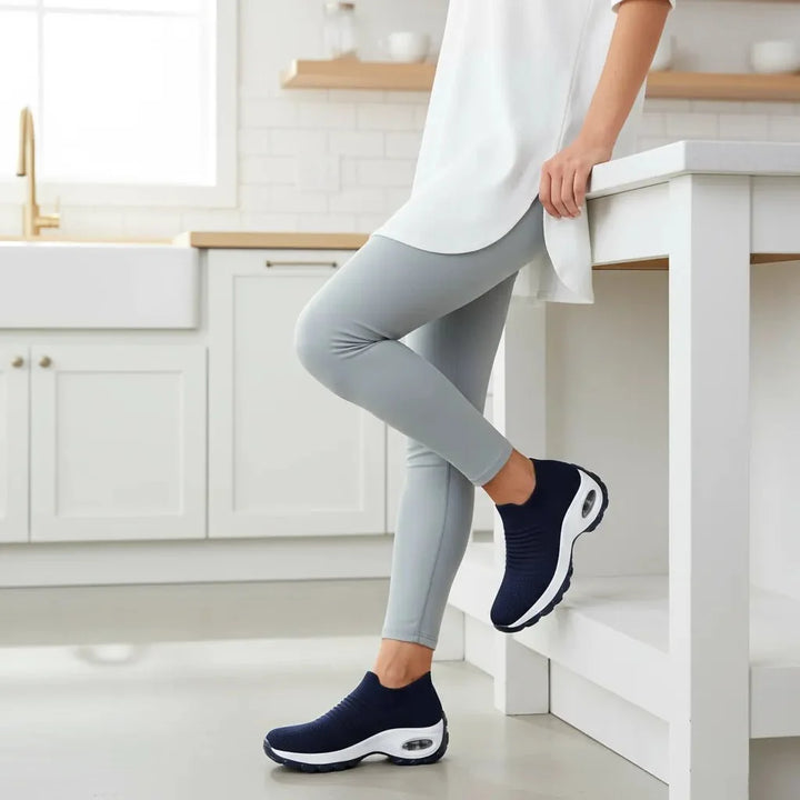 Comfortable Purple women's slip-on sneakers with arch support & air cushion for long walks.