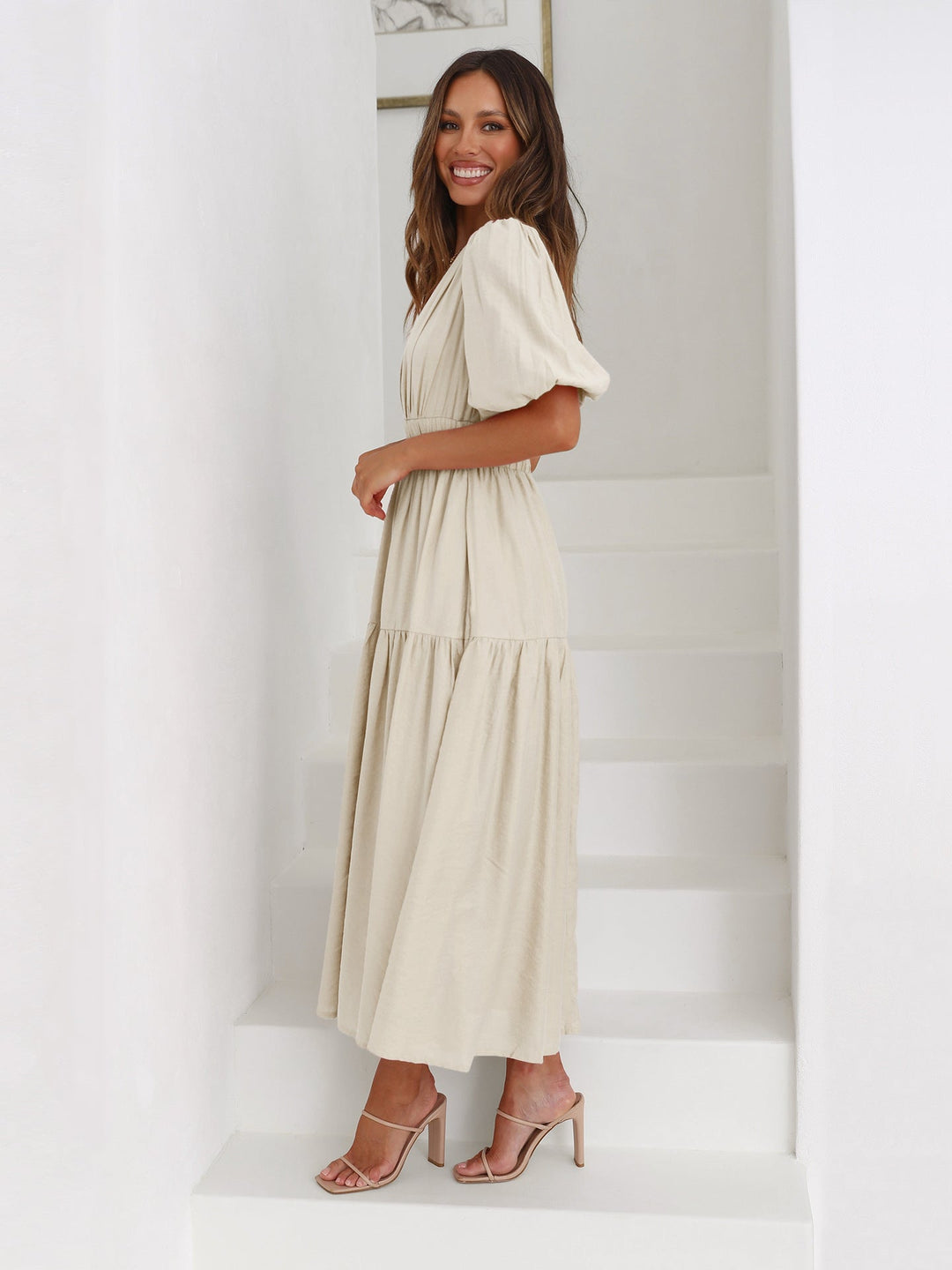 Graceful women's summer midi dress with elegant puff sleeves. Perfect for garden parties or events.