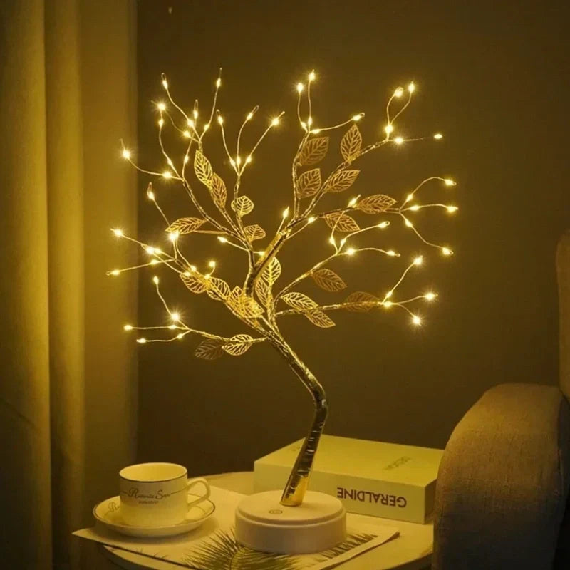 Flexible branch LED Bonsai Tree with golden leaves, casting a warm white glow. Unique table lamp gift.