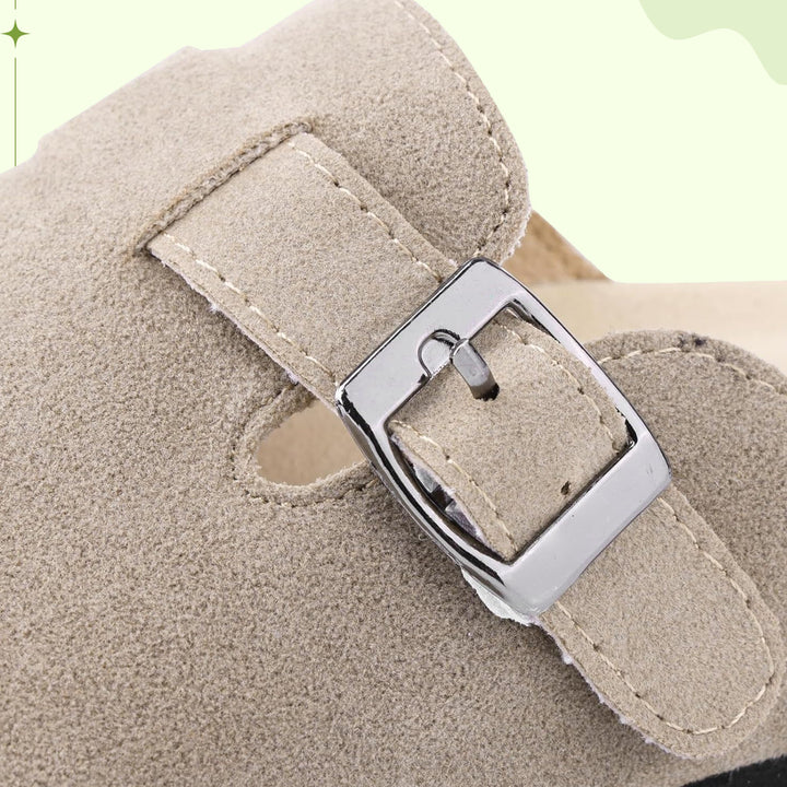 Stylish women's cork clogs with arch support and adjustable strap for comfort.
