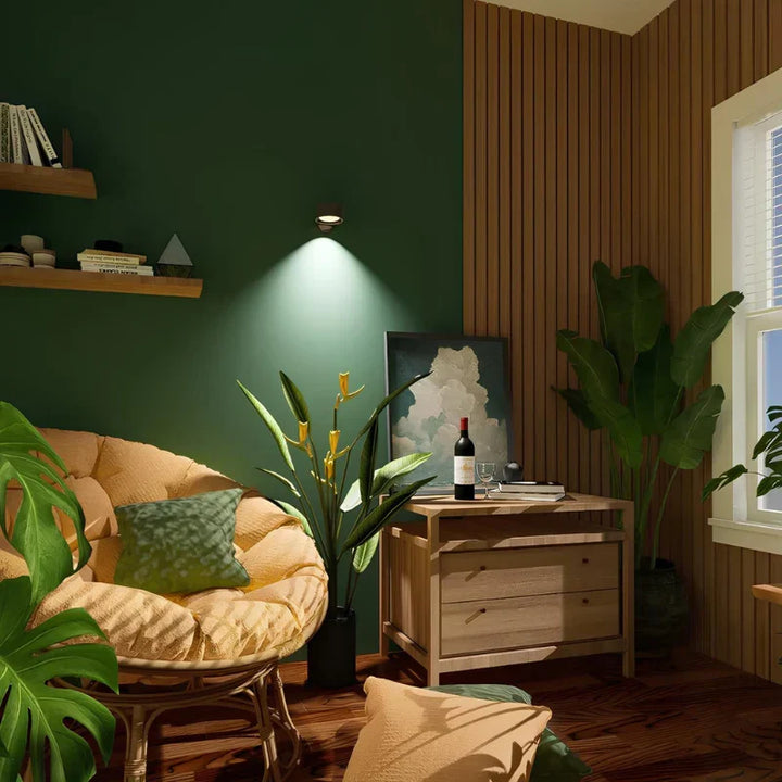 Cordless LED wall lamp with magnetic base, 360° adjustable for reading or task lighting.