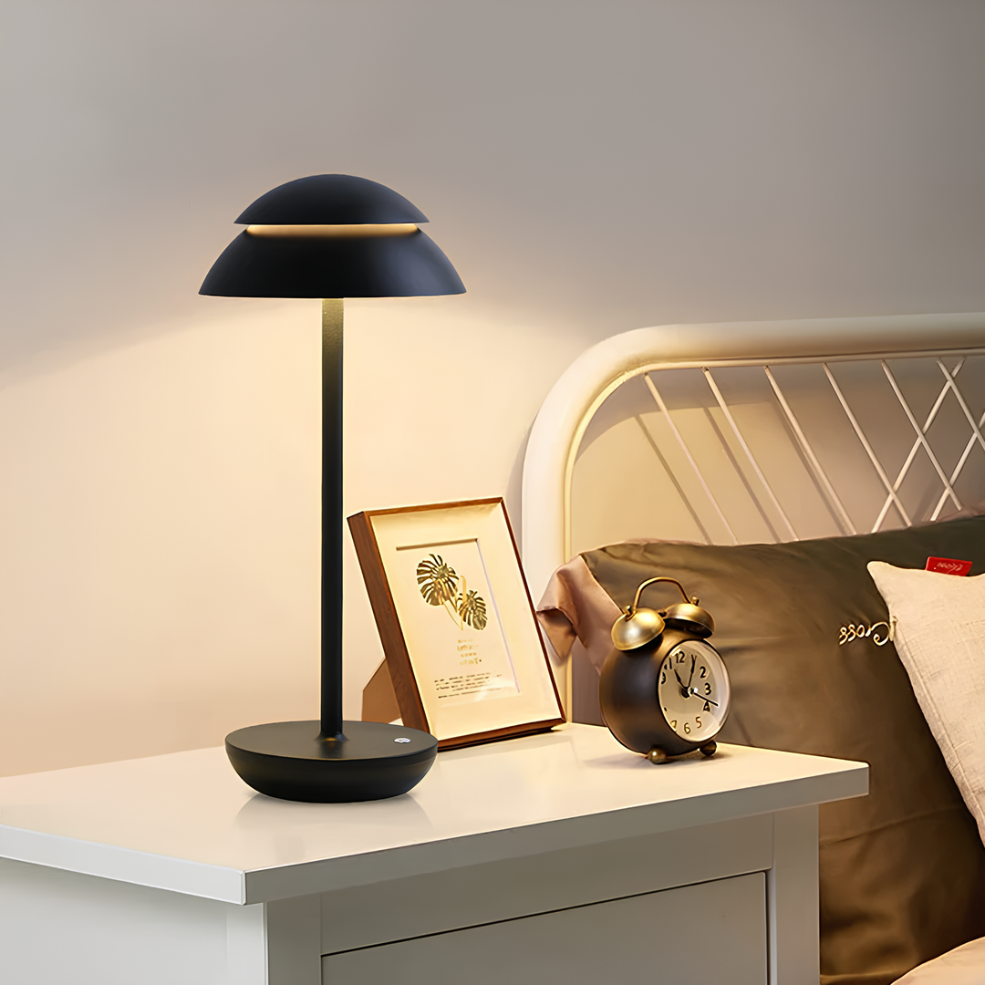 Cordless LED table lamp on charging base, modern minimalist design, rechargeable for portable use.