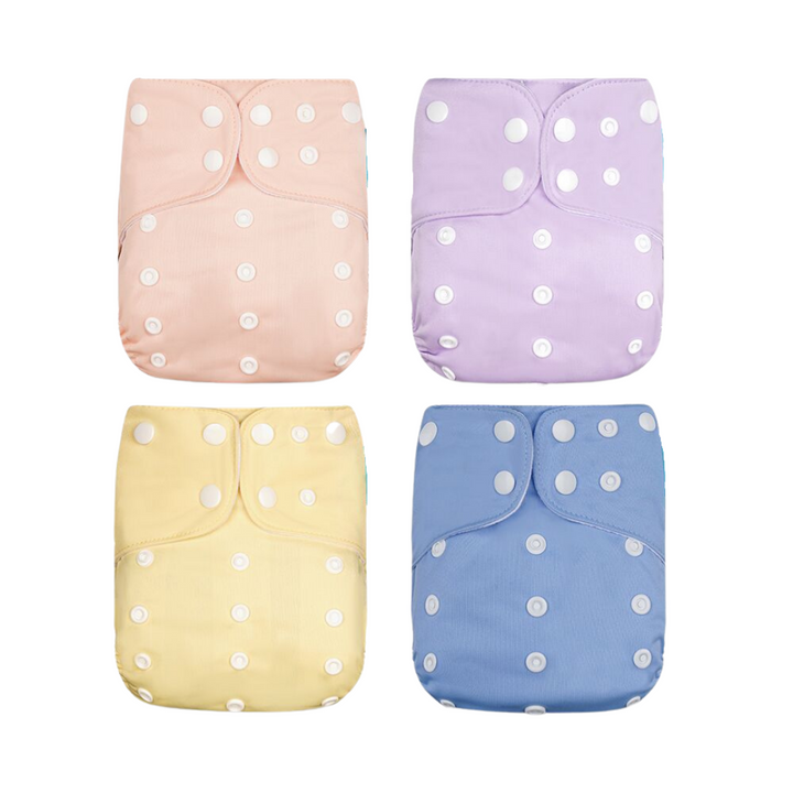 Parent gently changing baby with a soft, leak-proof reusable cloth diaper.