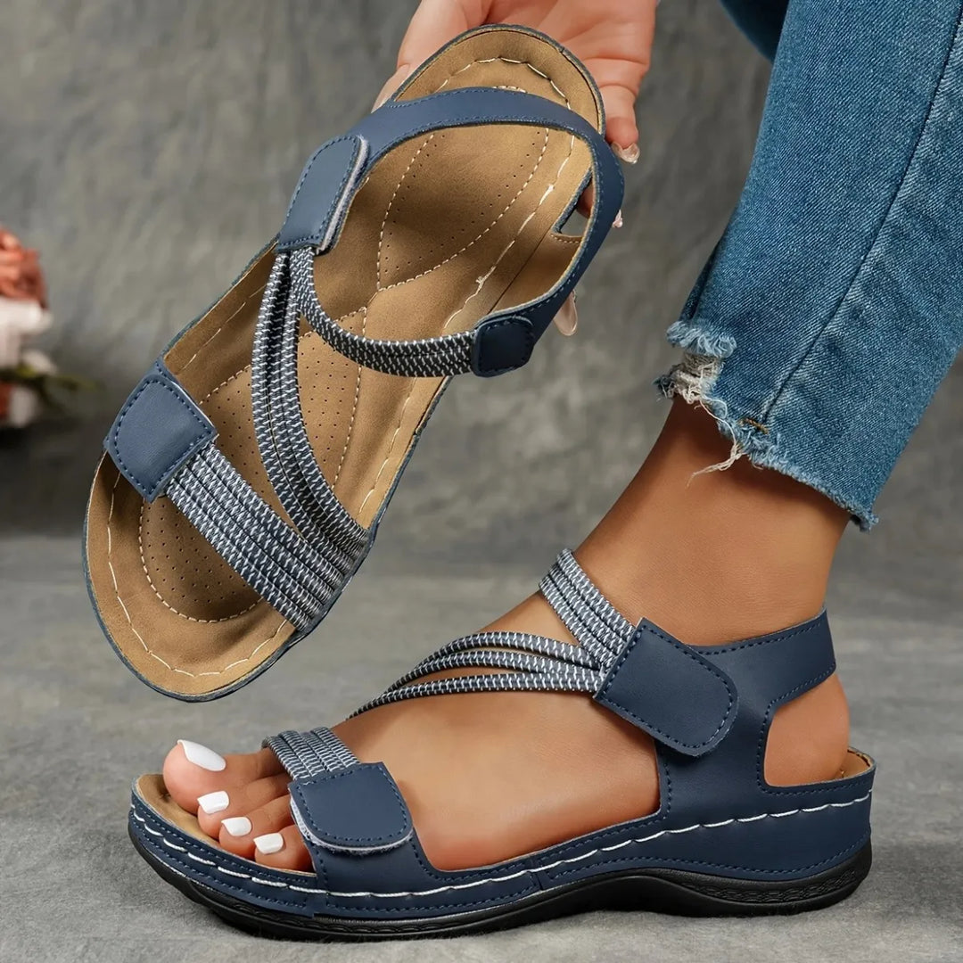 Women's comfort sandals with adjustable straps, cushioned sole for walking.
