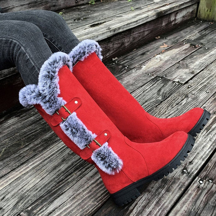 Women's knee-high boots with stylish buckles. Comfortable & tall winter footwear for fashion-forward women.