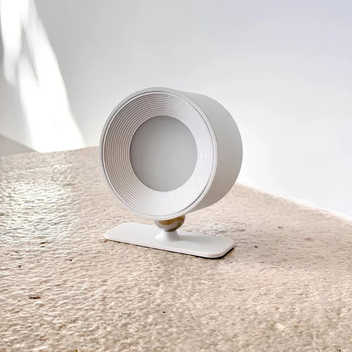 Modern Nvroome cordless wall lamp, 360° rotating head for focused or ambient lighting.