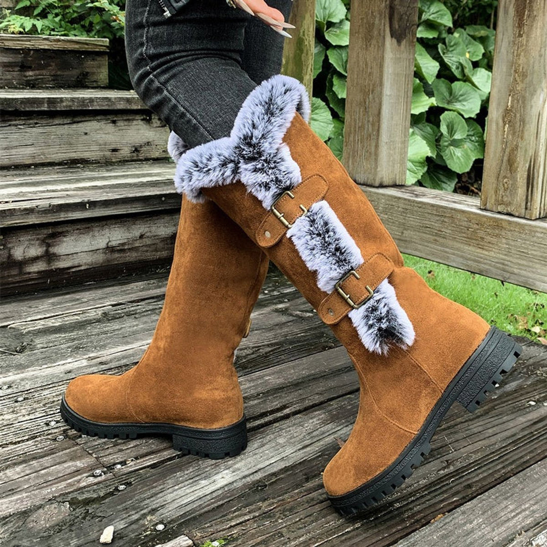 Cozy women's buckle knee-high boots. Stylish winter footwear offering warmth, comfort, and seasonal flair.