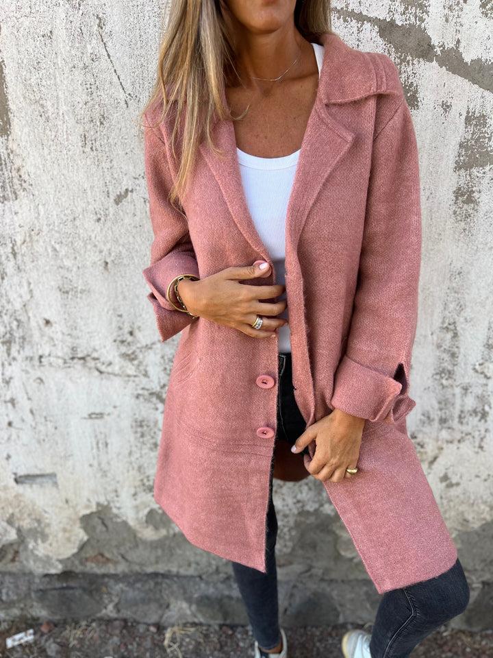 Stylish women's long knit coat with button closure & pockets. Perfect for autumn wear.