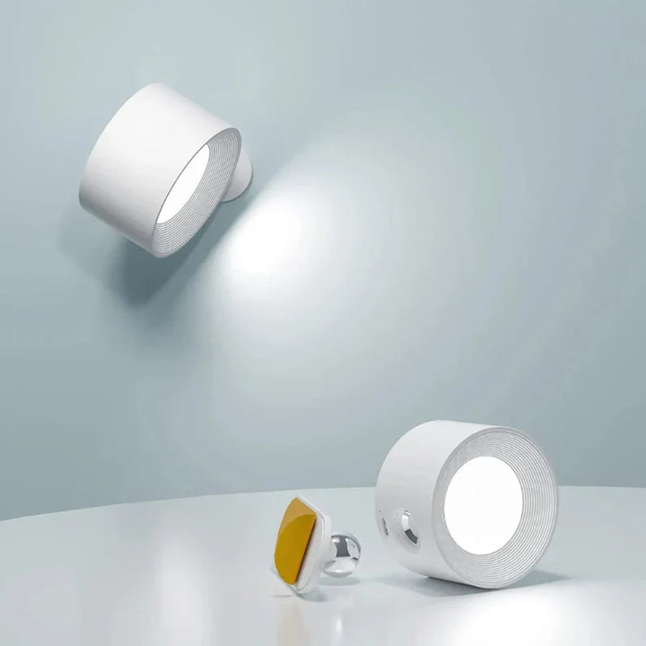 Cordless LED wall lamp with 360° rotation, perfect for modern home decor & ambient lighting.