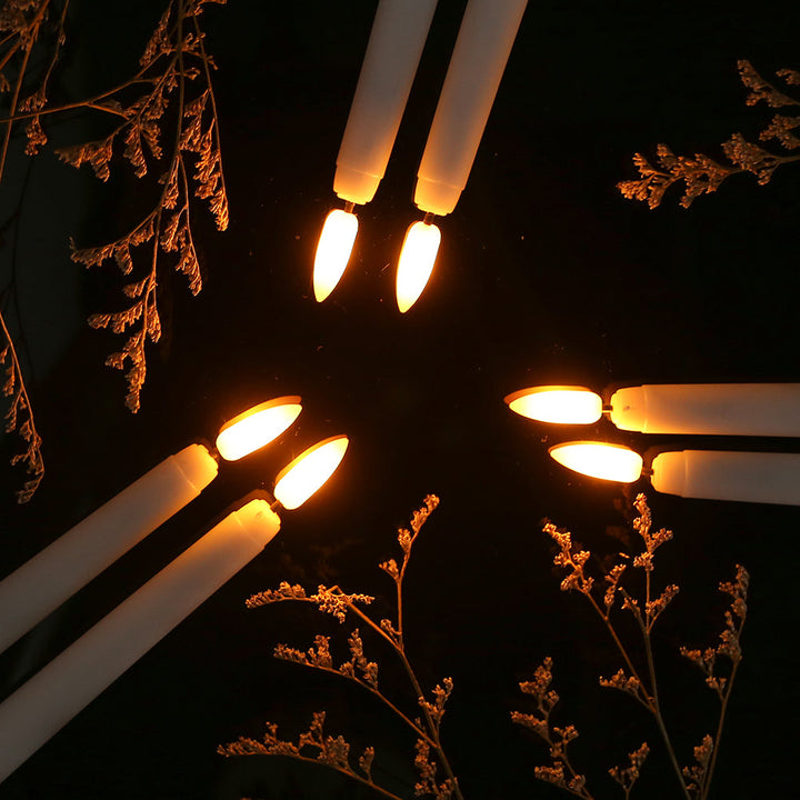 Elegant flameless LED taper candles, remote controlled with timer, providing safe and decorative ambiance.