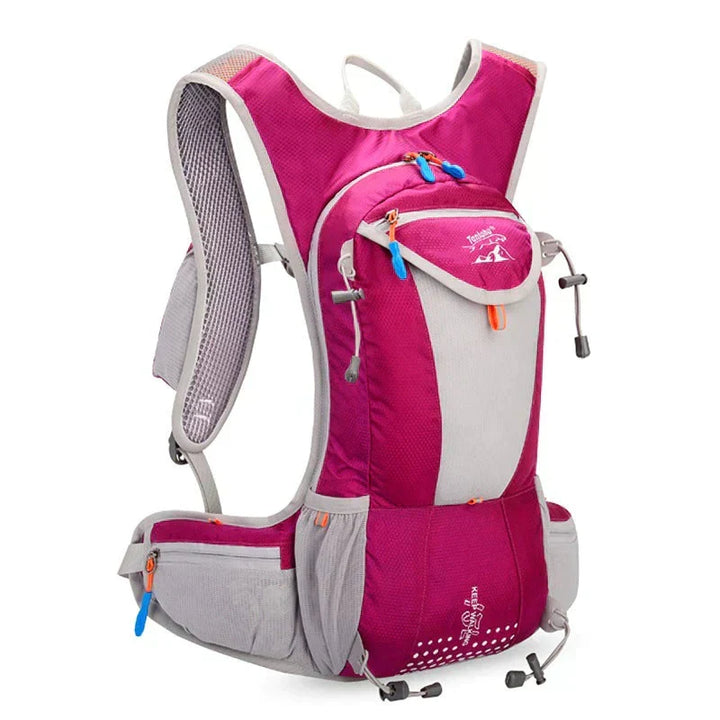Cyclist equipped with an aerodynamic lightweight hydration pack on a scenic outdoor trail.
