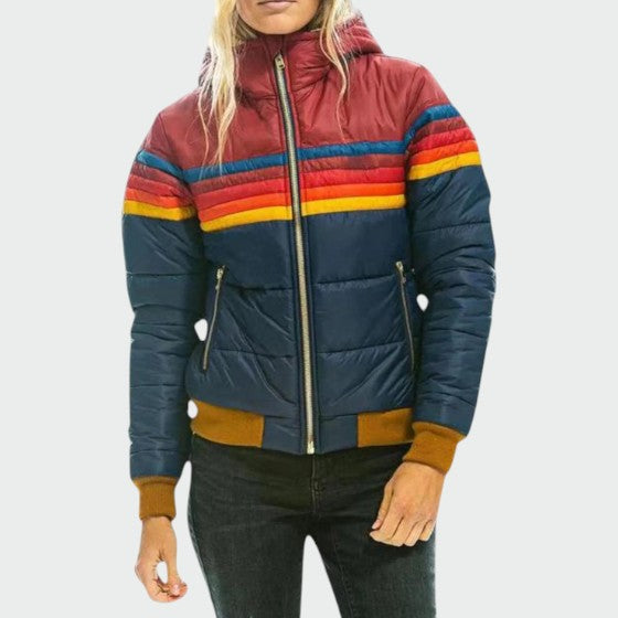 Women's waterproof puffer jacket, insulated for winter warmth and dry comfort in cold weather.