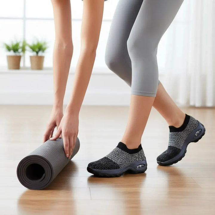 Comfortable Grey women's slip-on sneakers with arch support & air cushion for long walks.