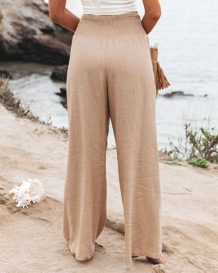 Breathable women's wide leg linen trousers, comfortable bottoms with a relaxed, flowy fit.