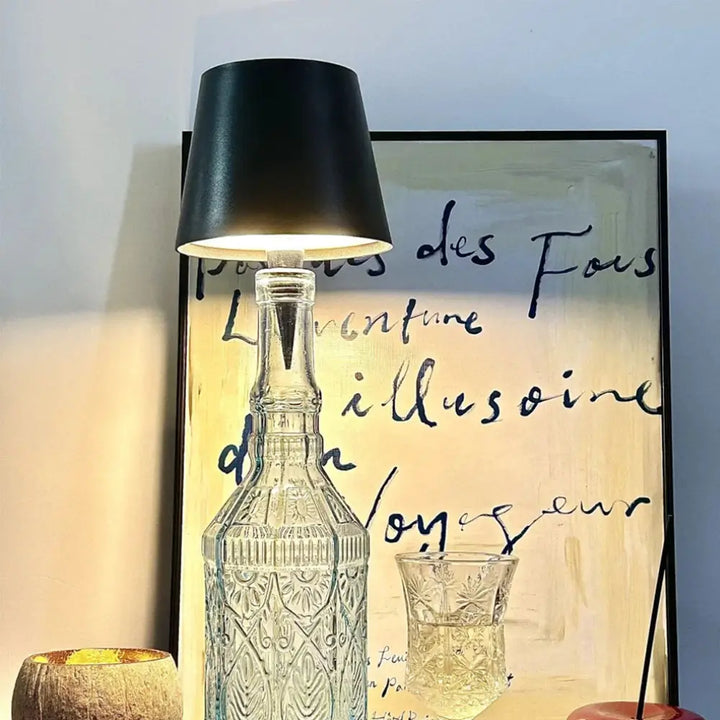 Tabletop LED bottle lamp cap, providing cordless, ambient light for indoor or outdoor spaces.