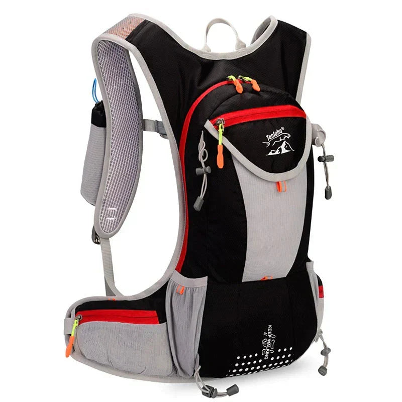 Hiker wearing a comfortable, secure unisex hydration pack while exploring a mountain path.