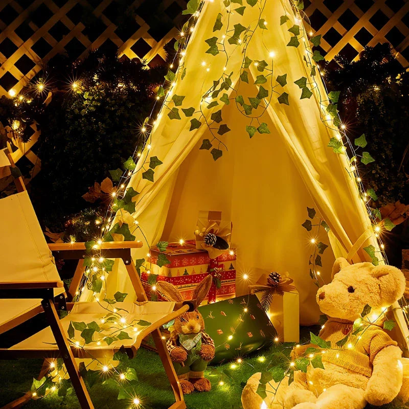 Warm white LED leaf vine string lights, perfect for enchanting home decor & party ambiance.