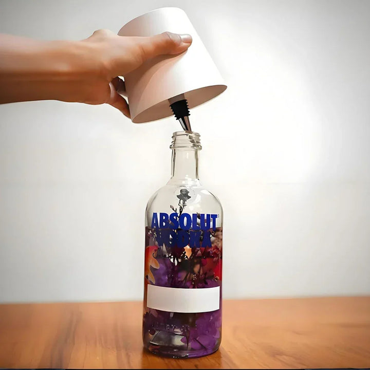 Ambient LED bottle light cap, enhancing home decor with soft, decorative lighting from glass.