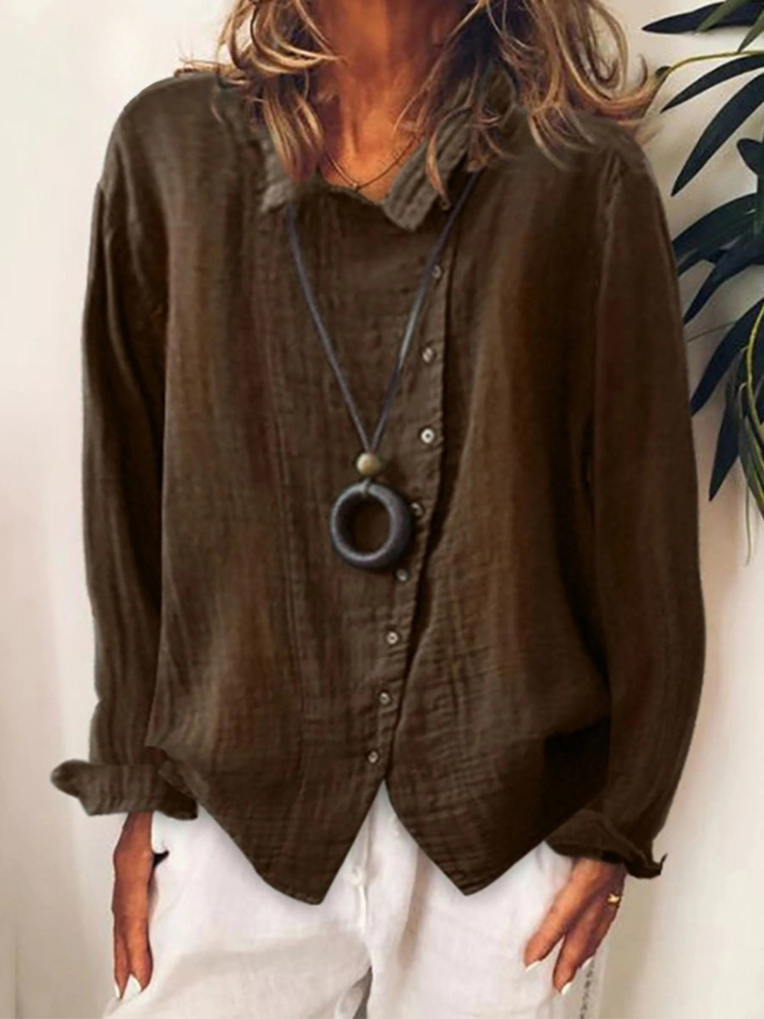 Comfortable women's button-down blouse with a relaxed fit. Long sleeve top, great for work or everyday casual wear.