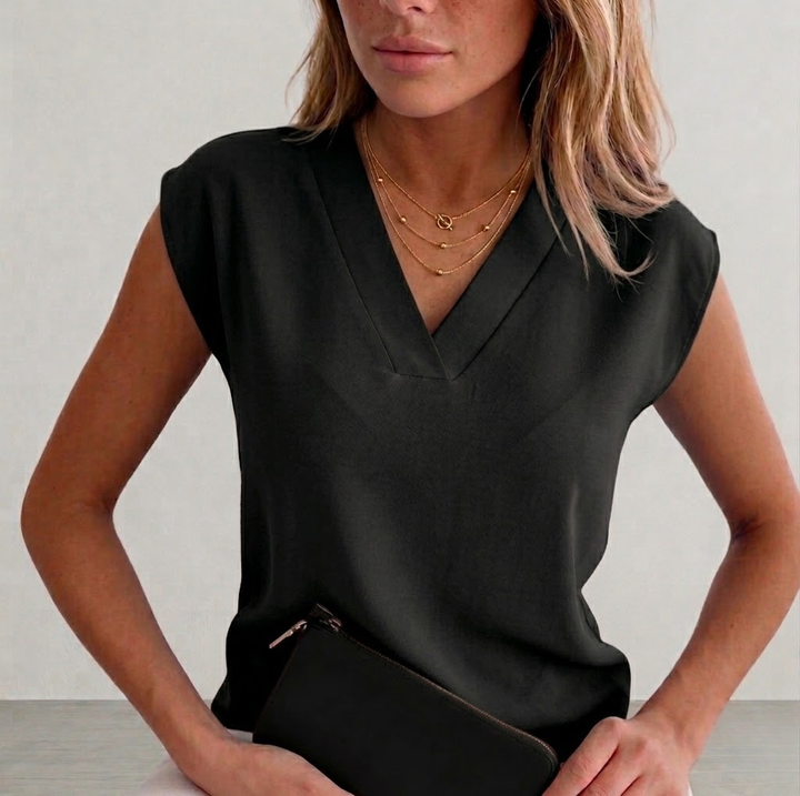Chic women's V-neck sleeveless blouse, an elegant fashion top for work, casual outings, or summer events. Business casual.