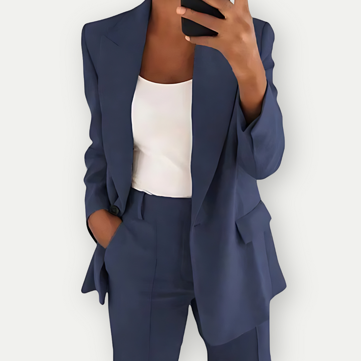 Elegant women's power suit set with a tailored blazer and matching trousers, perfect for business and office.