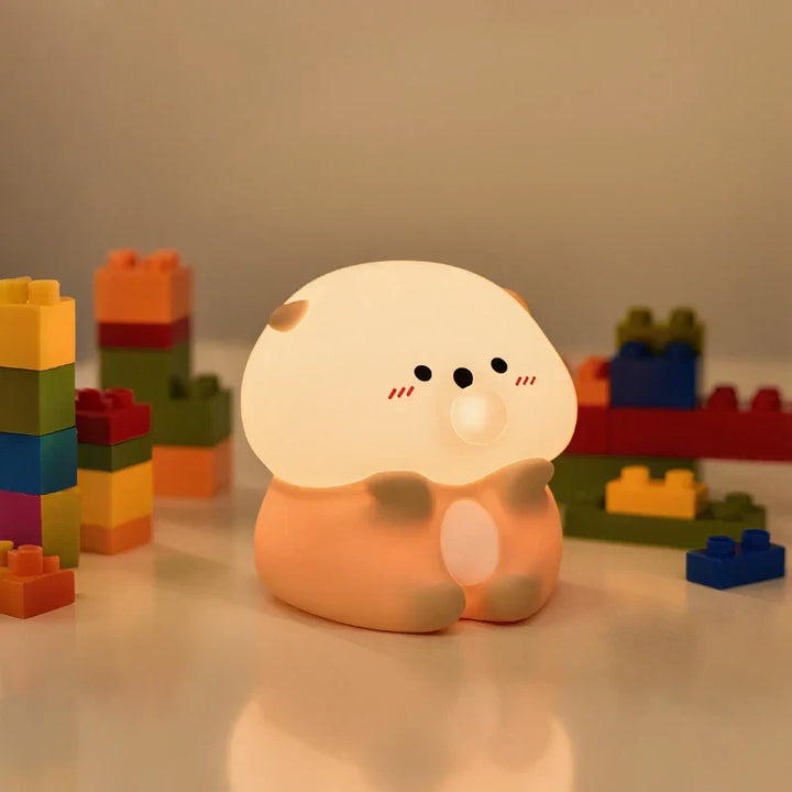 Gentle glowing animal sleep aid night light for peaceful nights. Dimmable, tap control.