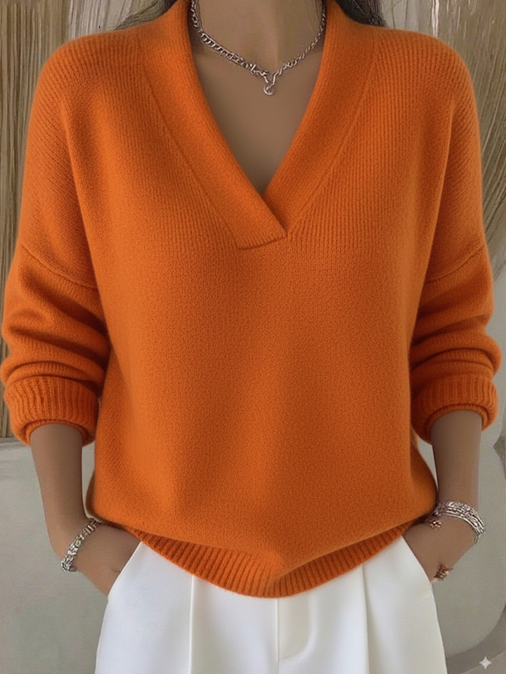 Cozy women's V-neck long-sleeve sweater in a soft knit, perfect for comfortable fall & winter layering.