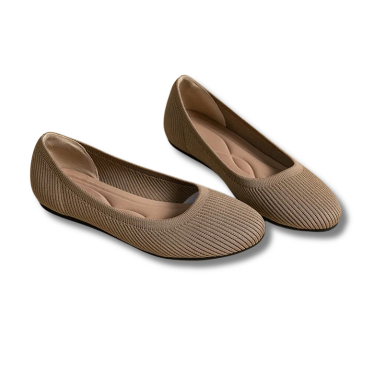 Elegant women's ballet flats in a neutral color, offering stylish comfort for casual and professional settings.