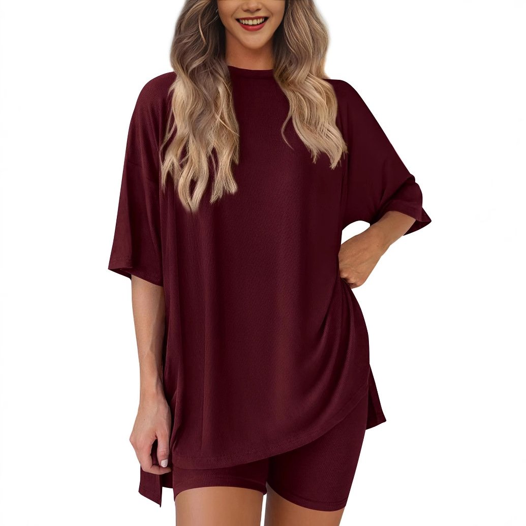 Back view of women's comfort wear: two-piece oversized t-shirt & shorts co-ord set.