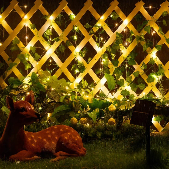 Indoor/outdoor warm white LED leaf garland string lights, adding nature's touch to your decor.