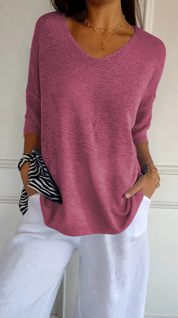 Comfortable long sleeve V-neck knit top for women. Versatile casual wear, chic & relaxed fit.