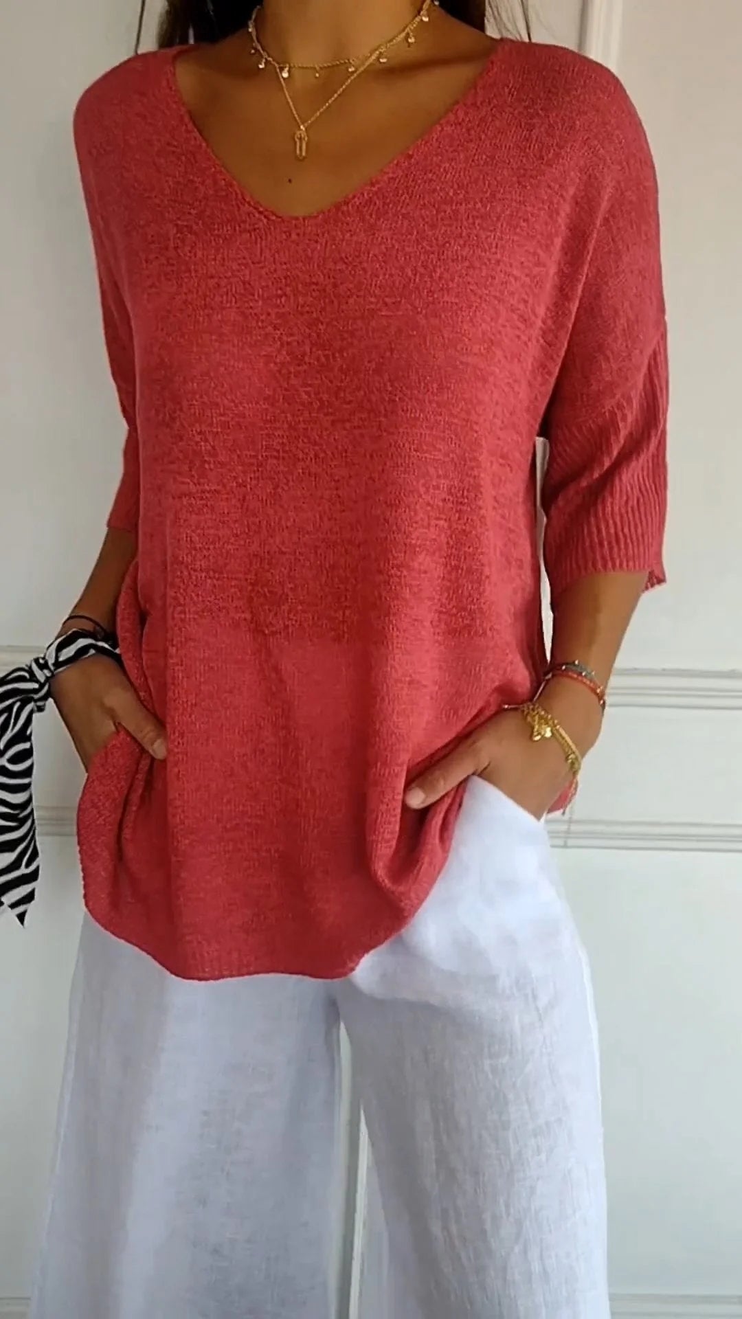 Chic women's V-neck knit top, perfect for casual everyday style & comfort. Long sleeve, relaxed fit.