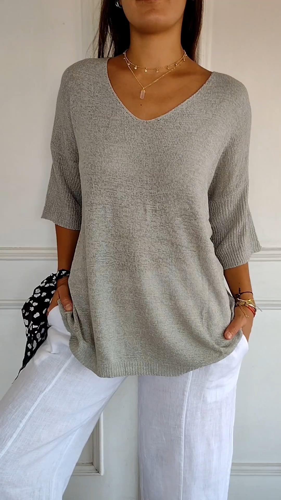 Casual chic women's V-neck knit top. Comfortable long sleeve design for versatile everyday apparel.