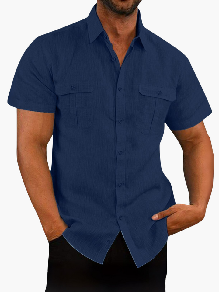 Close-up of men's fashionable short sleeve button-up shirt, highlighting the fabric & smart-casual style.
