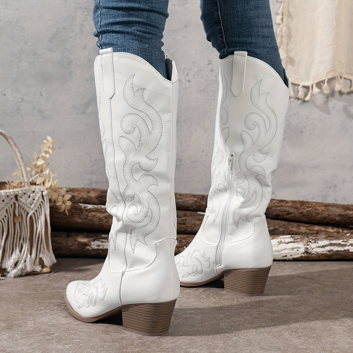 Rich texture of women's wide-calf western boots, classic design, authentic western stitching.