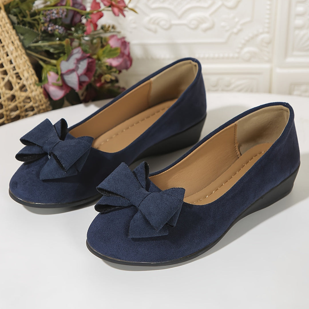 Red ladies' slip-on wedge ballet flats, casual footwear with a charming bow and comfortable design.