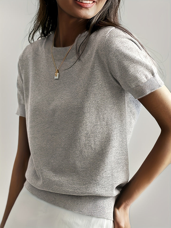 Minimalist short-sleeve top for women, designed for comfort and versatile fashion, a wardrobe staple.