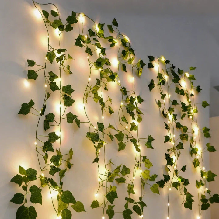 Warm white LED leaf vine lights, creating a soft, inviting glow for living rooms & festive events.
